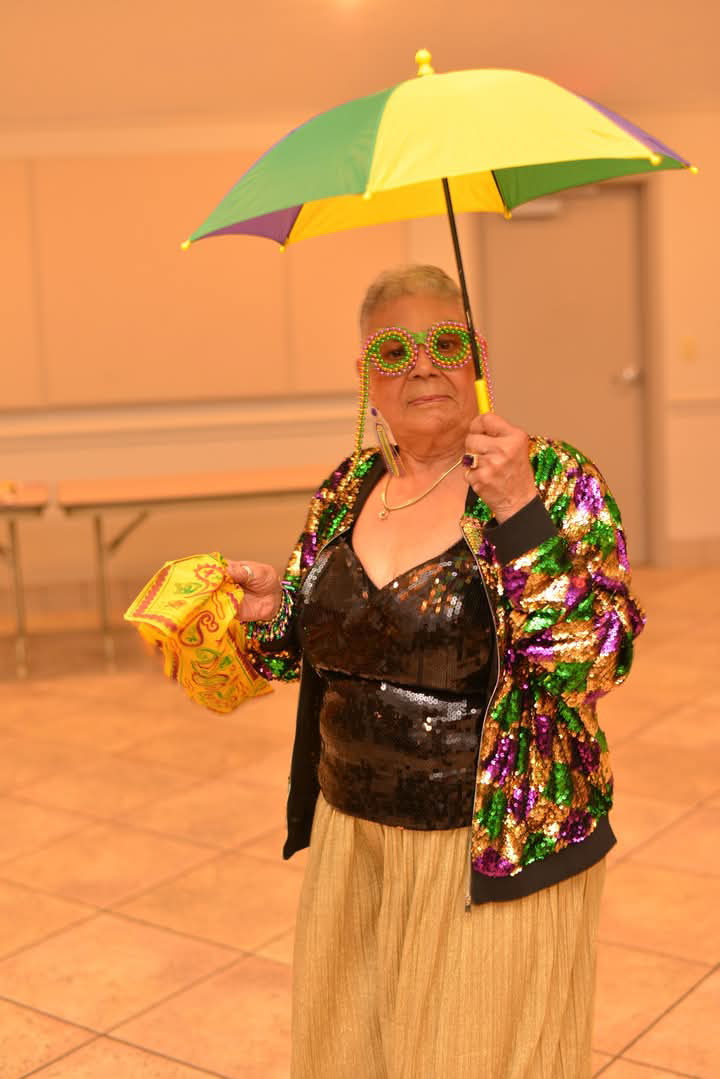 Guest in Mardi Gras sequins and glasses